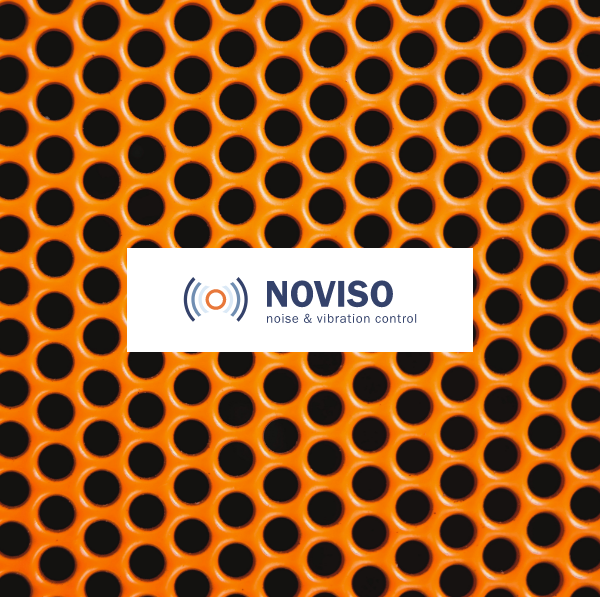 Orange perforated acoustic panel by Noviso
